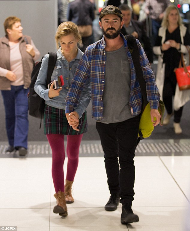 Low key look: Sporting a plaid mini-skirt and cropped denim jacket, the departing Home And Away star was a casual sight as the pair made their way across Melbourne airport 